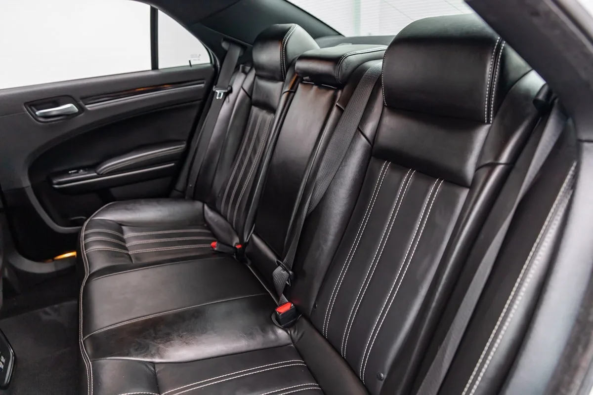 Executive sedan rear bench with stitched black leather seating