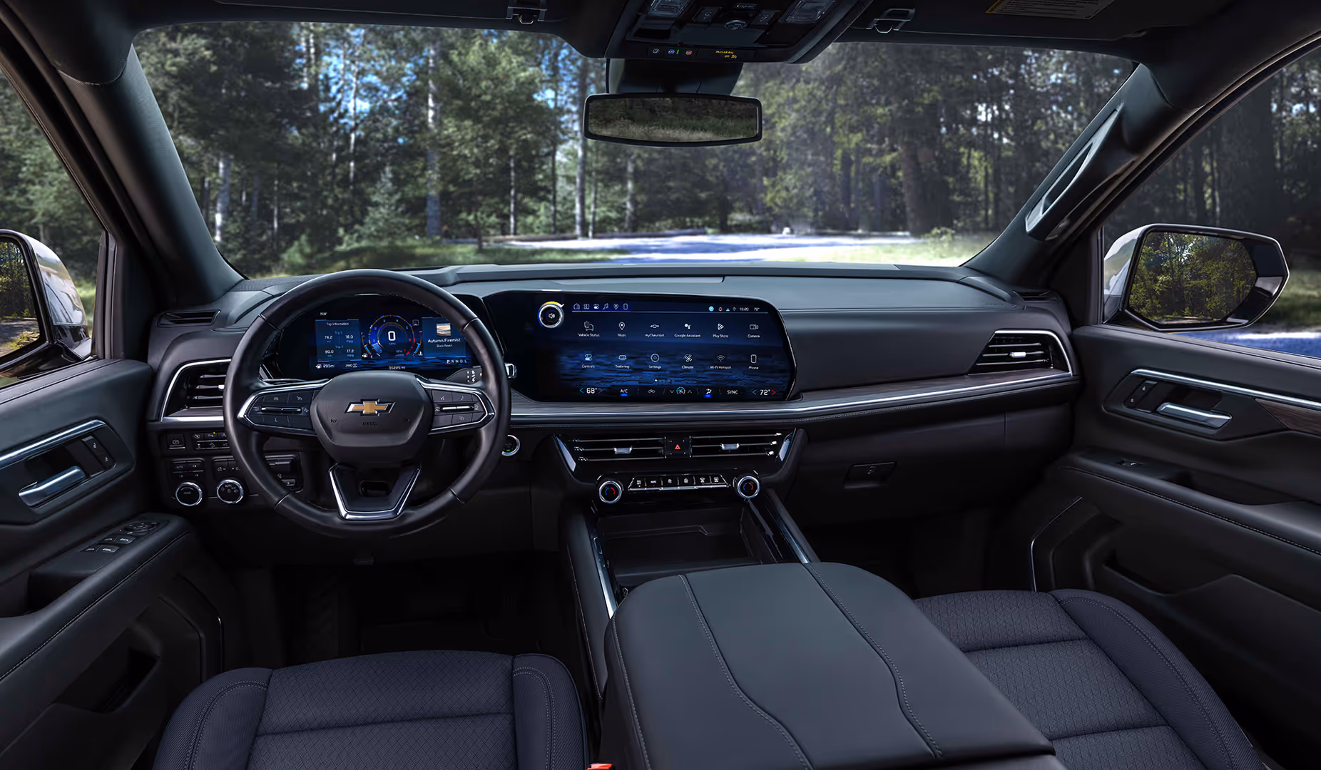Full-size executive SUV dashboard, steering wheel, and panoramic digital display