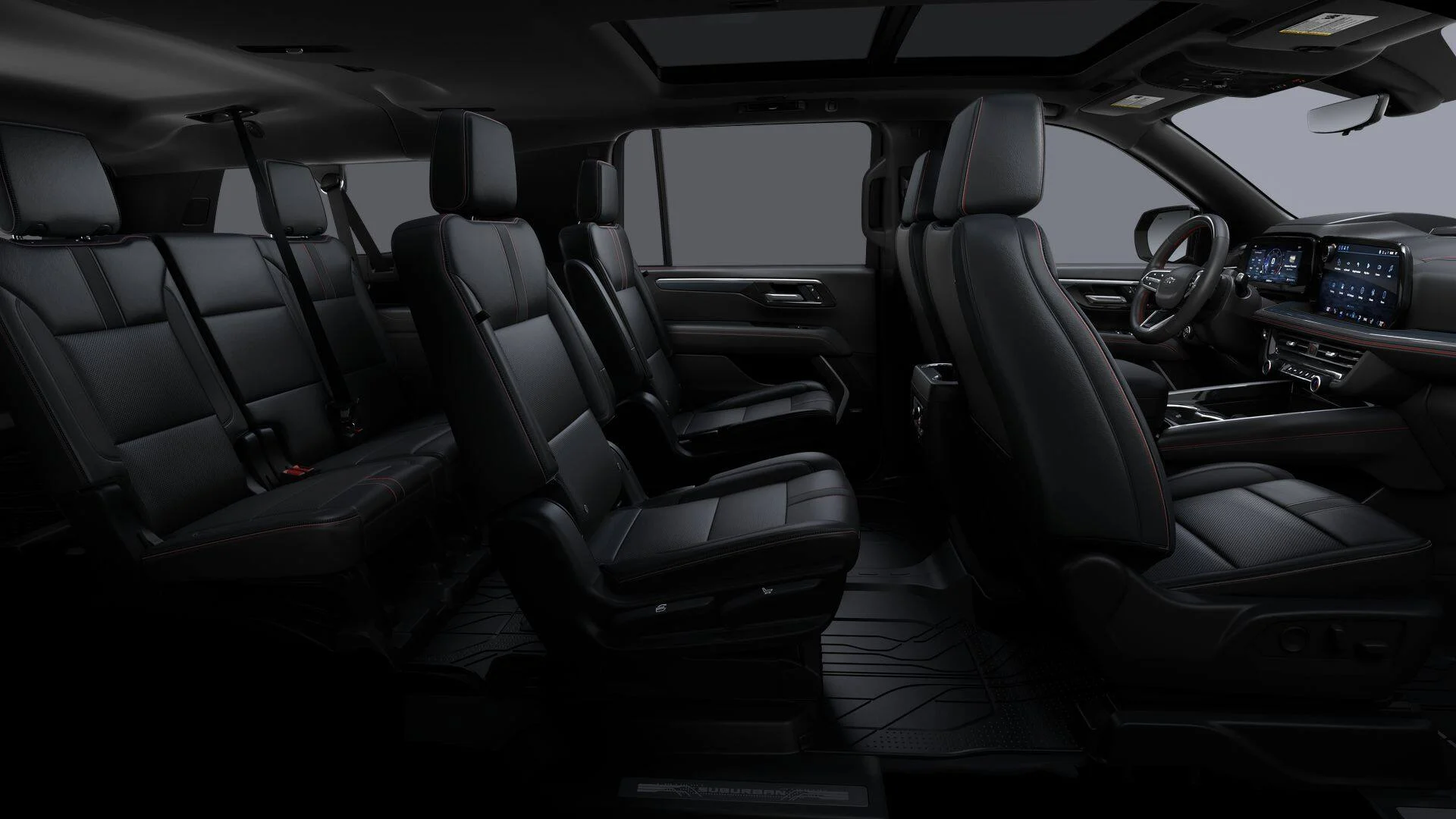 Full-size executive SUV interior showing three rows of black leather seating and the front cabin