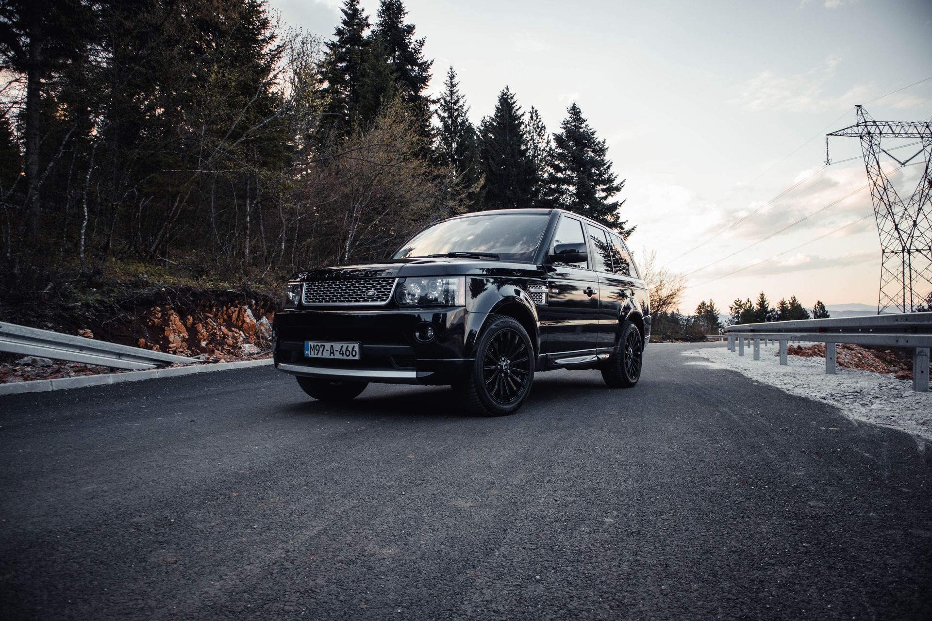 Black executive SUV on a quiet road